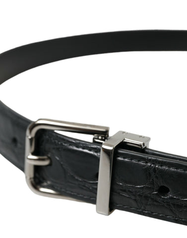 Black leather belt with silver metal buckle by Dolce & Gabbana, featuring a sleek design and adjustable strap.