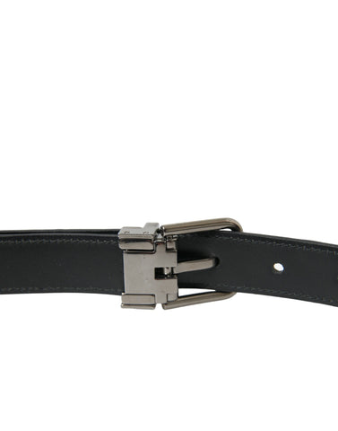 Black leather belt with silver metal buckle from Dolce & Gabbana, featuring a sleek and stylish design.