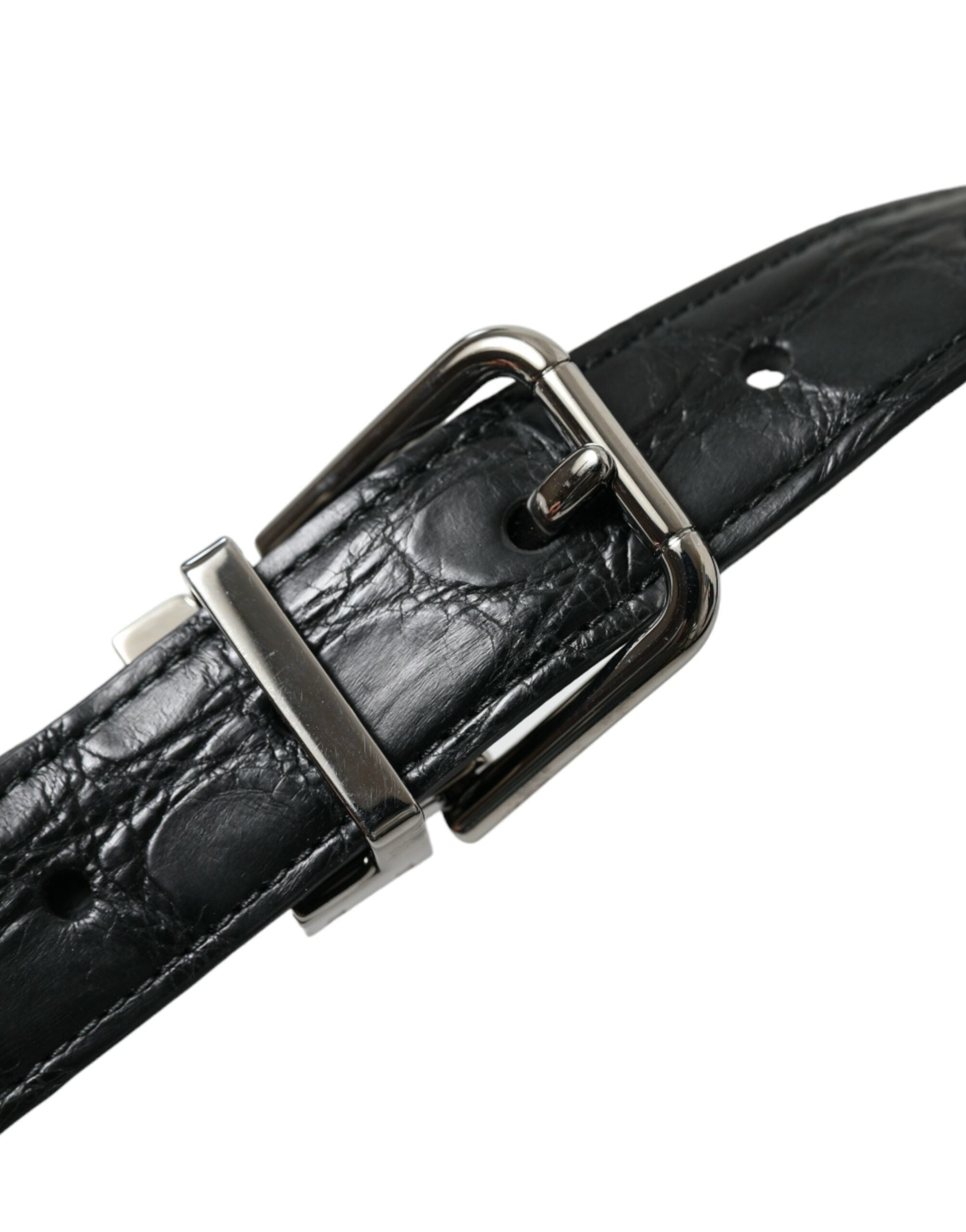 Black leather belt with silver metal buckle from Dolce & Gabbana, showing the sleek strap and stylish buckle detail.