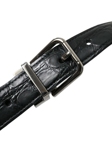 Black leather belt with silver metal buckle from Dolce & Gabbana, showing the sleek strap and stylish buckle detail.