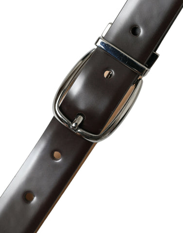 Dark brown leather belt with silver metal buckle from Dolce & Gabbana, featuring a sleek and stylish design.
