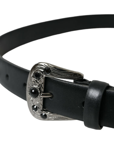 Black leather belt with embellished engraved buckle by Dolce & Gabbana, featuring intricate detailing and stylish design.