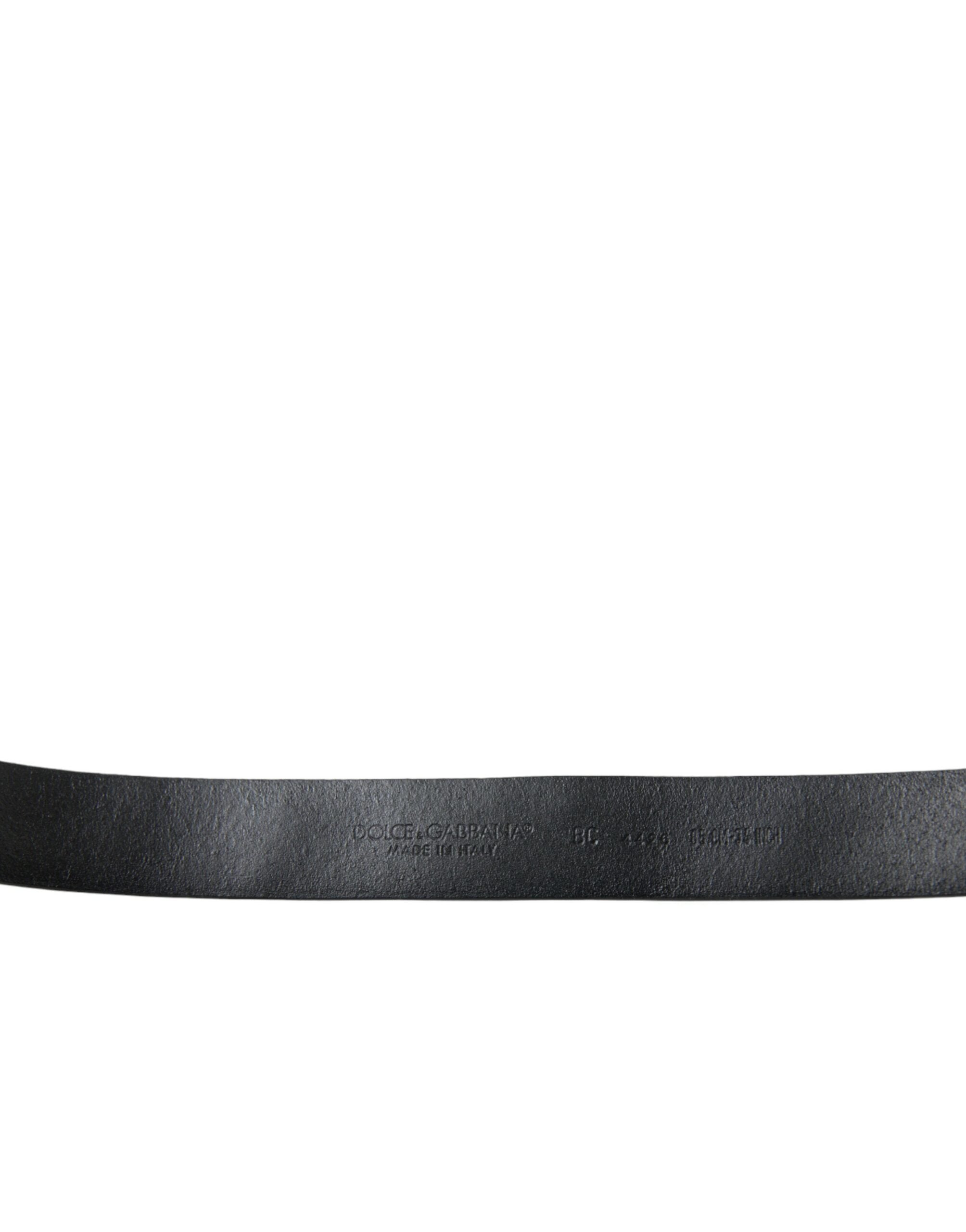Black leather belt with engraved buckle and embellishments from Dolce & Gabbana.