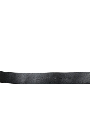 Black leather belt with engraved buckle and embellishments from Dolce & Gabbana.