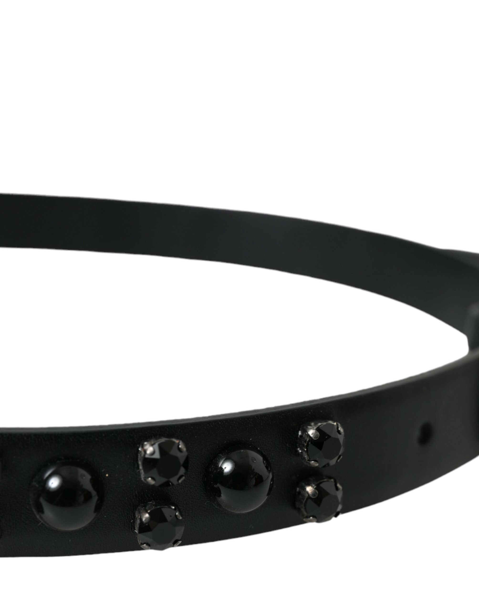 Black leather belt with engraved buckle and embellishments from Dolce & Gabbana, featuring detailed craftsmanship and stylish design.