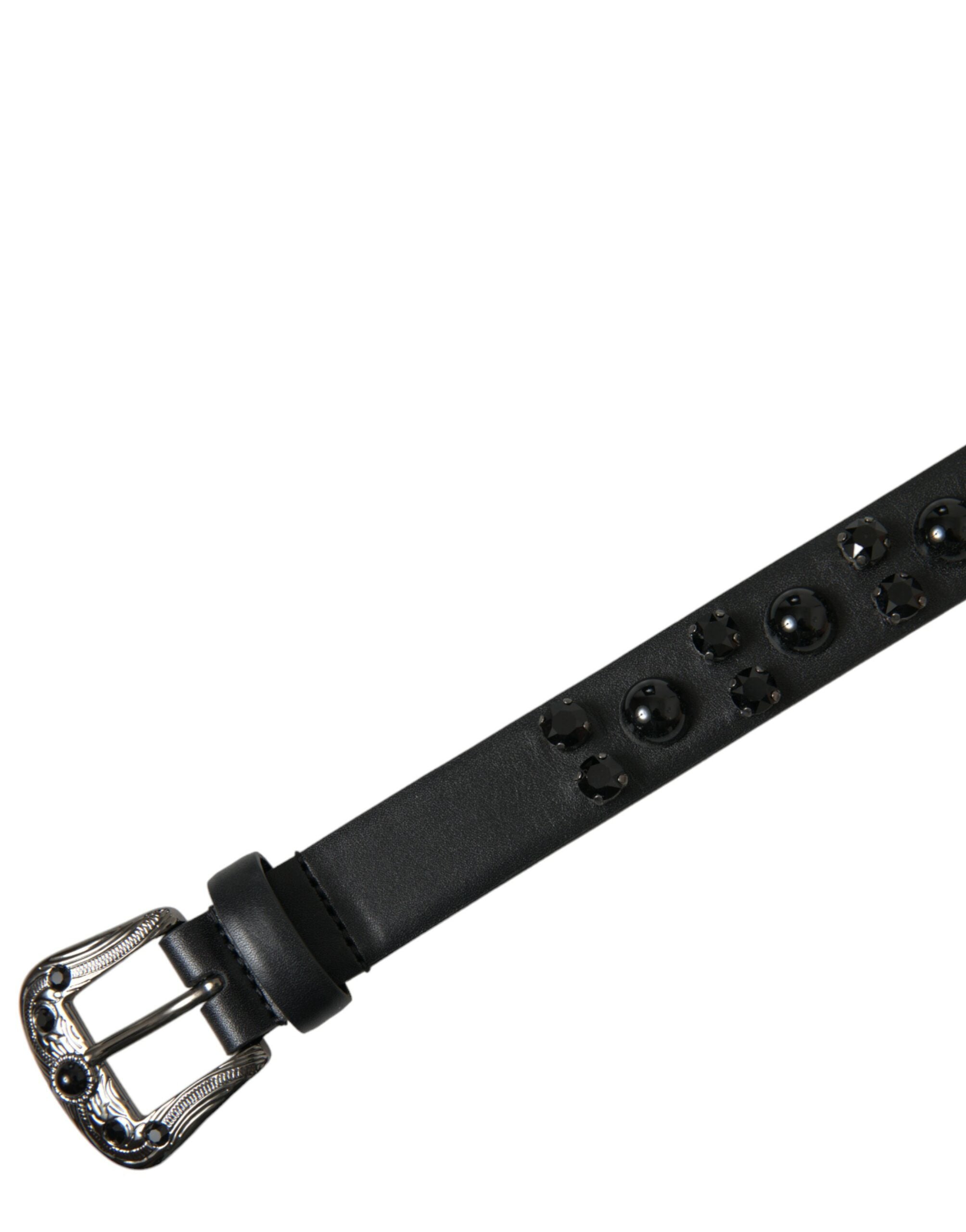 Black leather belt with embellished and engraved buckle by Dolce & Gabbana, featuring intricate decorative details.