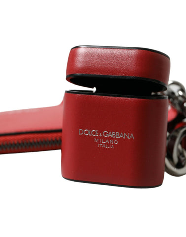 Red leather AirPods case with silver metal logo strap pouch from Dolce & Gabbana, featuring a sleek, compact design.