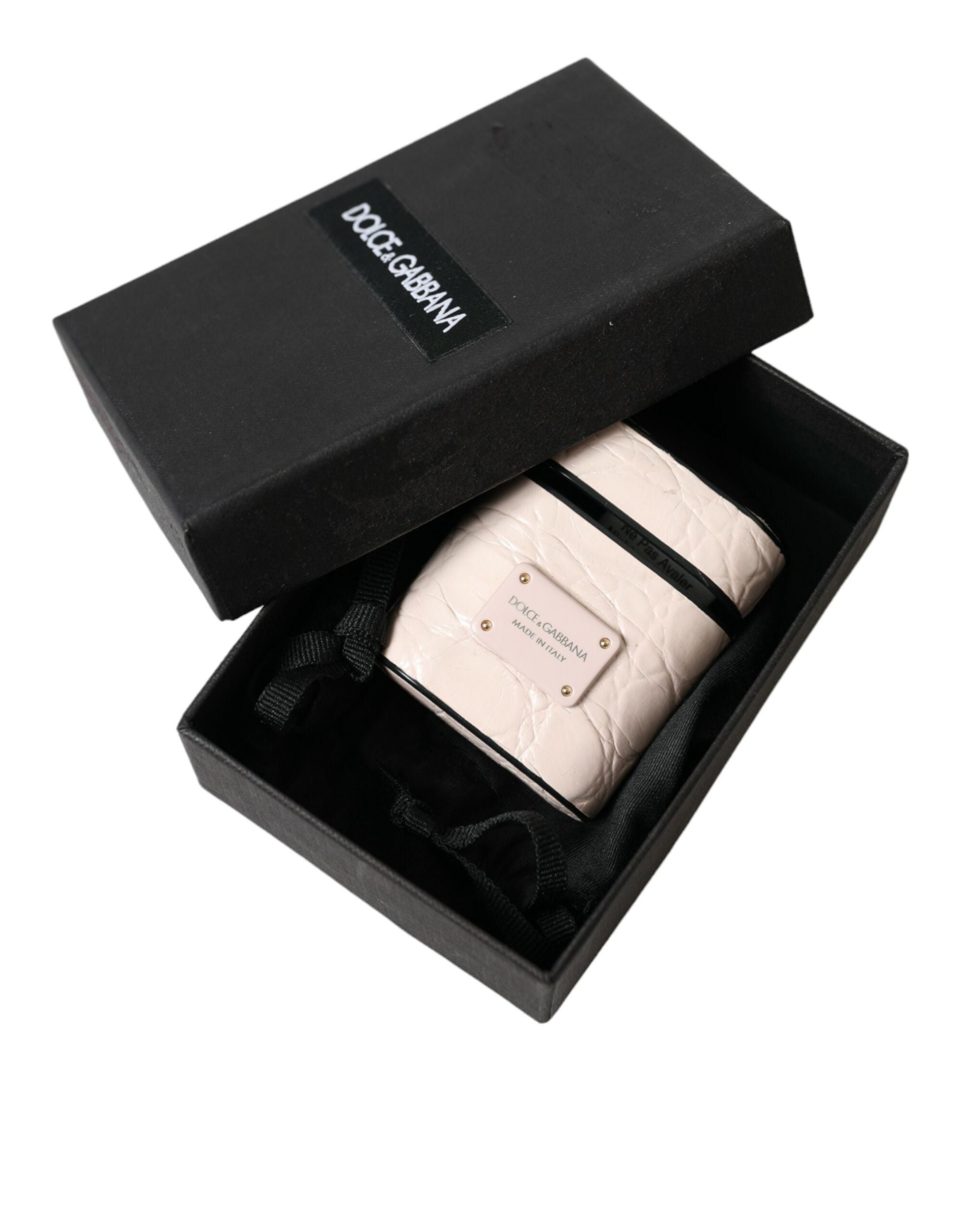 Light pink calf leather AirPods case with Dolce & Gabbana metal logo plaque, stylish protective accessory.