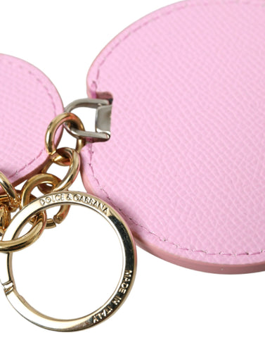 Pink calf leather Dolce & Gabbana keyring with gold metal logo print and keychain attachment.
