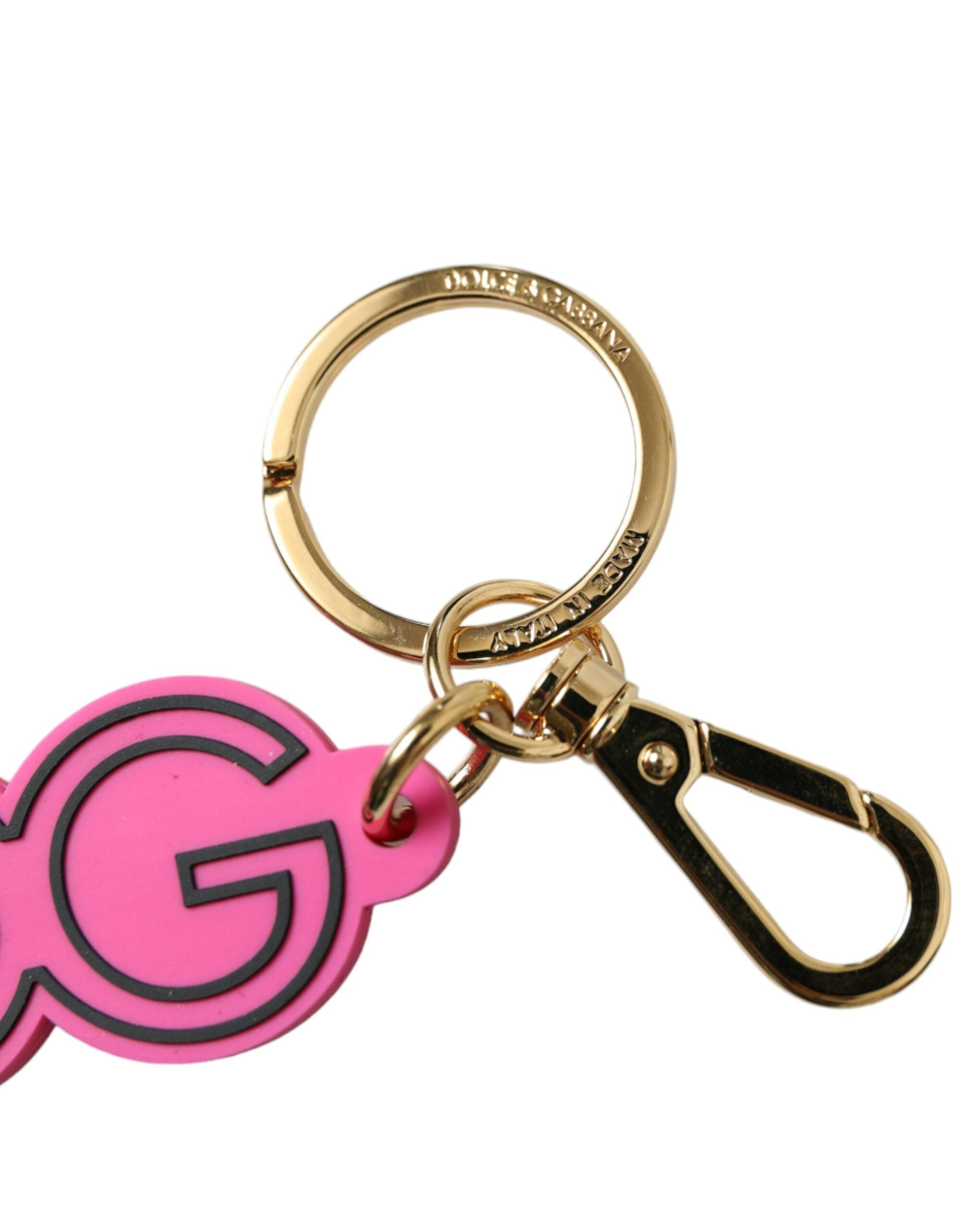 Pink rubber and gold-tone metal Dolce & Gabbana logo keyring with a stylish keychain design.