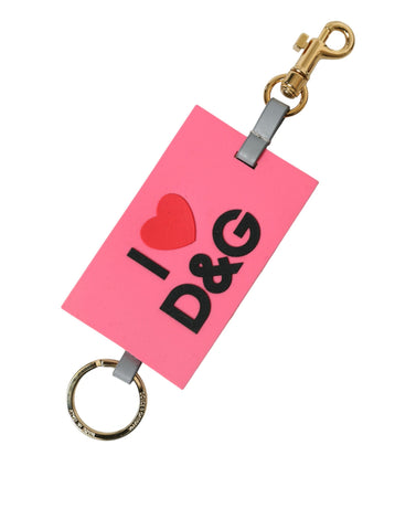 Pink silicone keychain with gold brass Dolce & Gabbana DG logo, featuring a sleek and stylish accessory design.