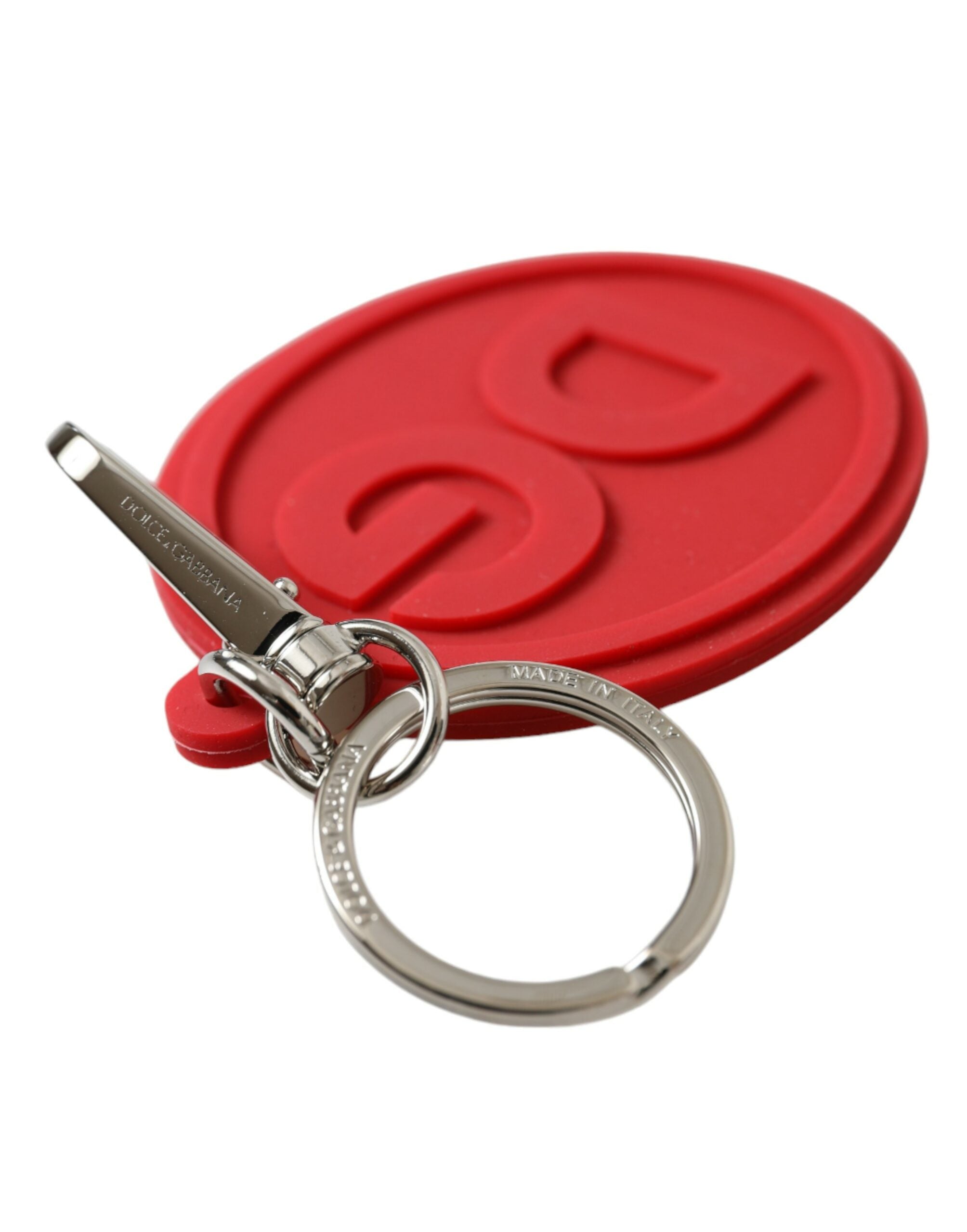Red rubber Dolce & Gabbana keyring with silver brass DG logo, featuring a durable metal keychain design.