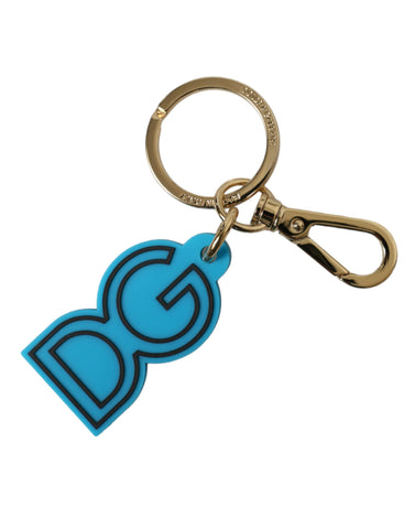 Blue rubber and gold-tone metal Dolce & Gabbana logo keyring with engraved DG emblem and keyring attachment.