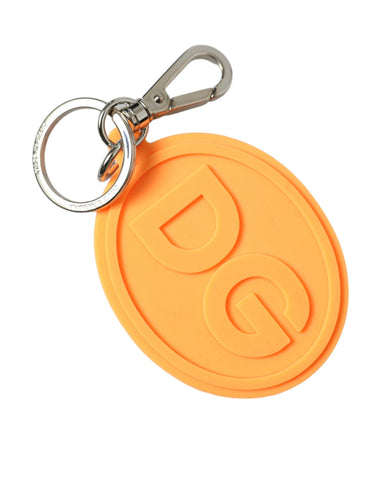 Orange rubber Dolce & Gabbana logo keyring with silver brass metal keychain, featuring a bold DG emblem and vibrant design.