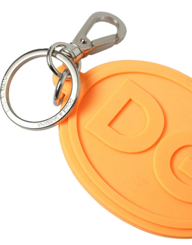 Orange rubber keyring with Dolce & Gabbana DG logo and silver brass metal keychain attached.
