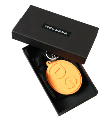 Orange rubber keyring with Dolce & Gabbana DG logo and silver brass metal keychain, featuring a stylish and vibrant design.