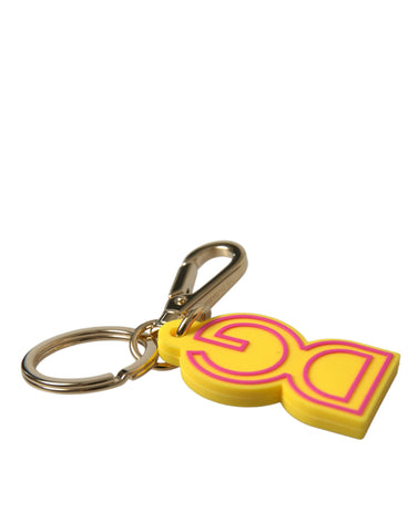 Yellow rubber and gold-tone metal Dolce & Gabbana logo keyring with D&G branding and keychain attachment