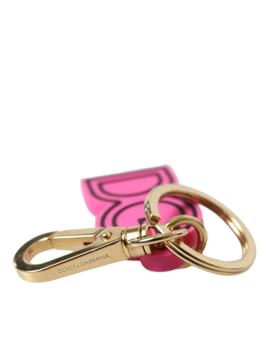 Pink rubber and gold-tone metal Dolce & Gabbana logo keyring with a stylish keychain design.