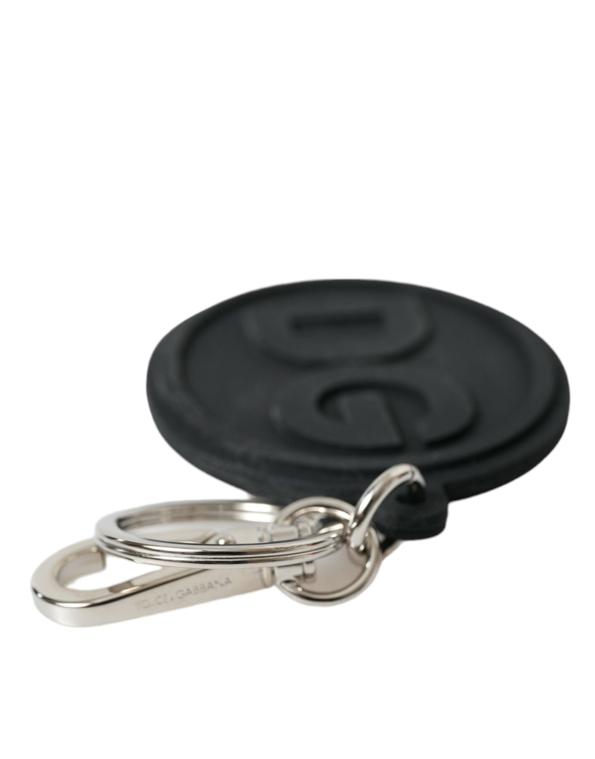 Black rubber Dolce & Gabbana logo keyring with silver brass metal keychain and DG branding, stylish accessory for keys.