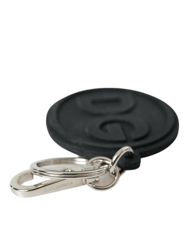 Black rubber Dolce & Gabbana logo keyring with silver brass metal keychain and DG branding, stylish accessory for keys.