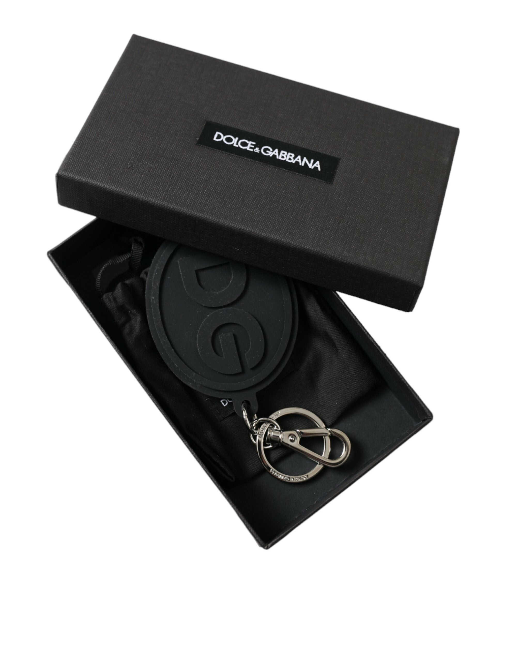 Black rubber Dolce & Gabbana keyring with silver brass DG logo, featuring a metal keychain attachment.