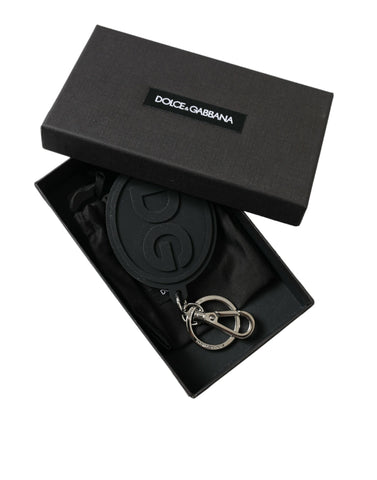 Black rubber Dolce & Gabbana keyring with silver brass DG logo, featuring a metal keychain attachment.