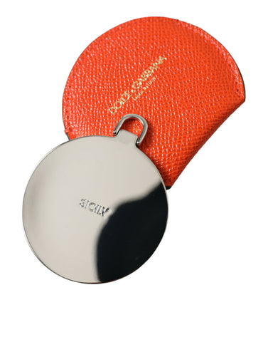 Orange calfskin leather Dolce & Gabbana round logo hand mirror holder with embossed logo and smooth finish.