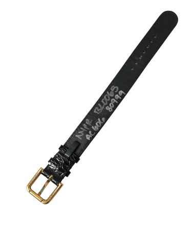 Black textured leather armband with gold-tone metal buckle by Dolce & Gabbana, stylish accessory with intricate leather detailing.