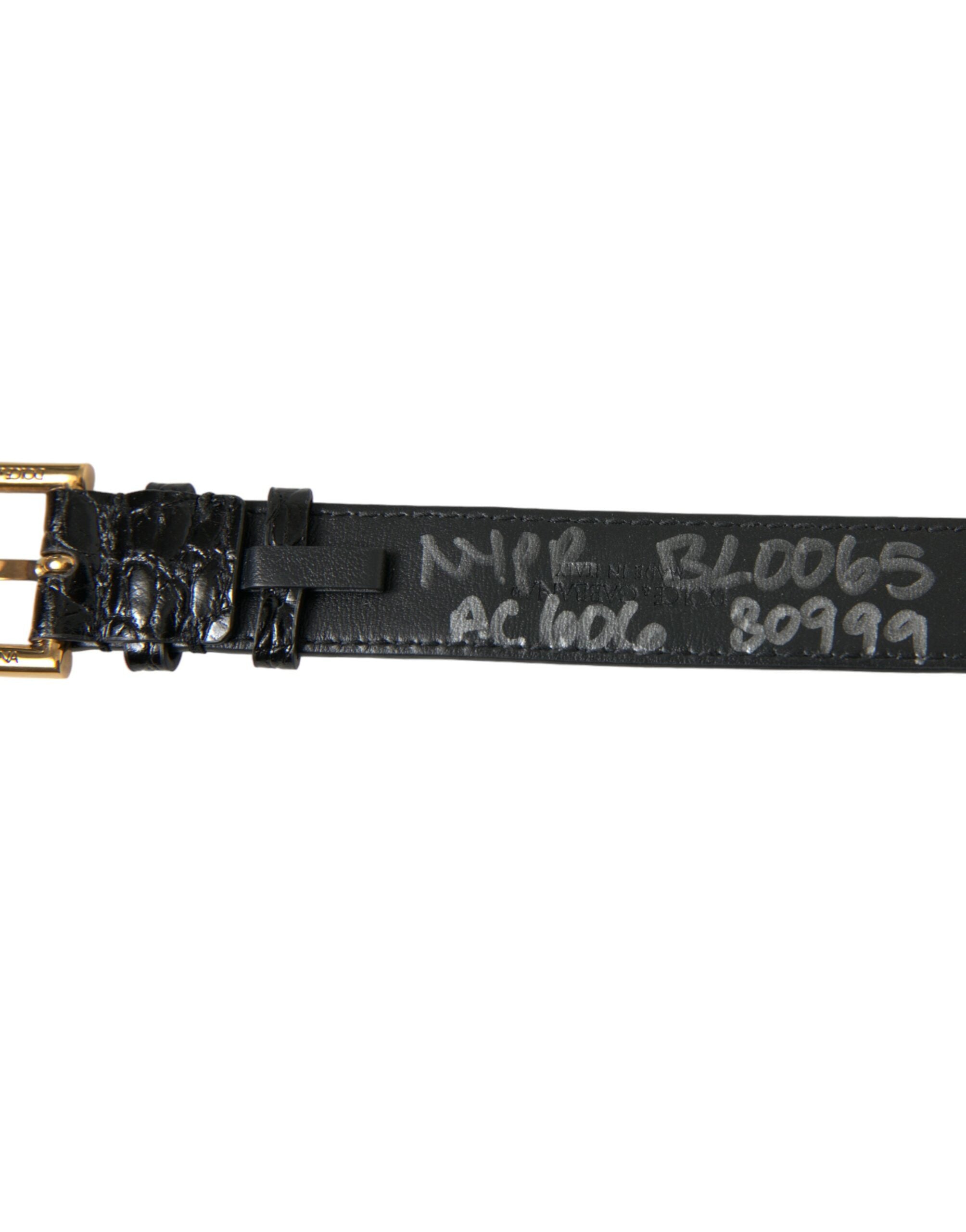 Black textured leather armband by Dolce & Gabbana with a gold-tone metal buckle, stylish and modern accessory.