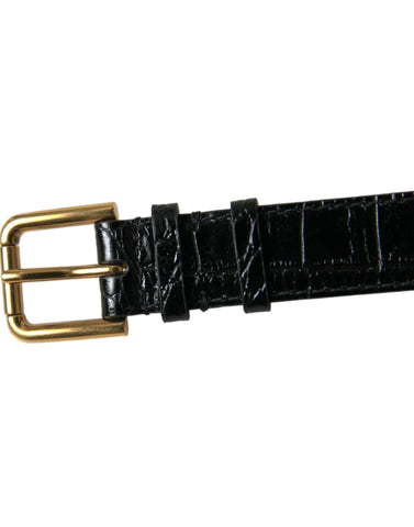 Black textured leather armband with gold tone metal buckle by Dolce & Gabbana, stylish accessory with detailed craftsmanship.
