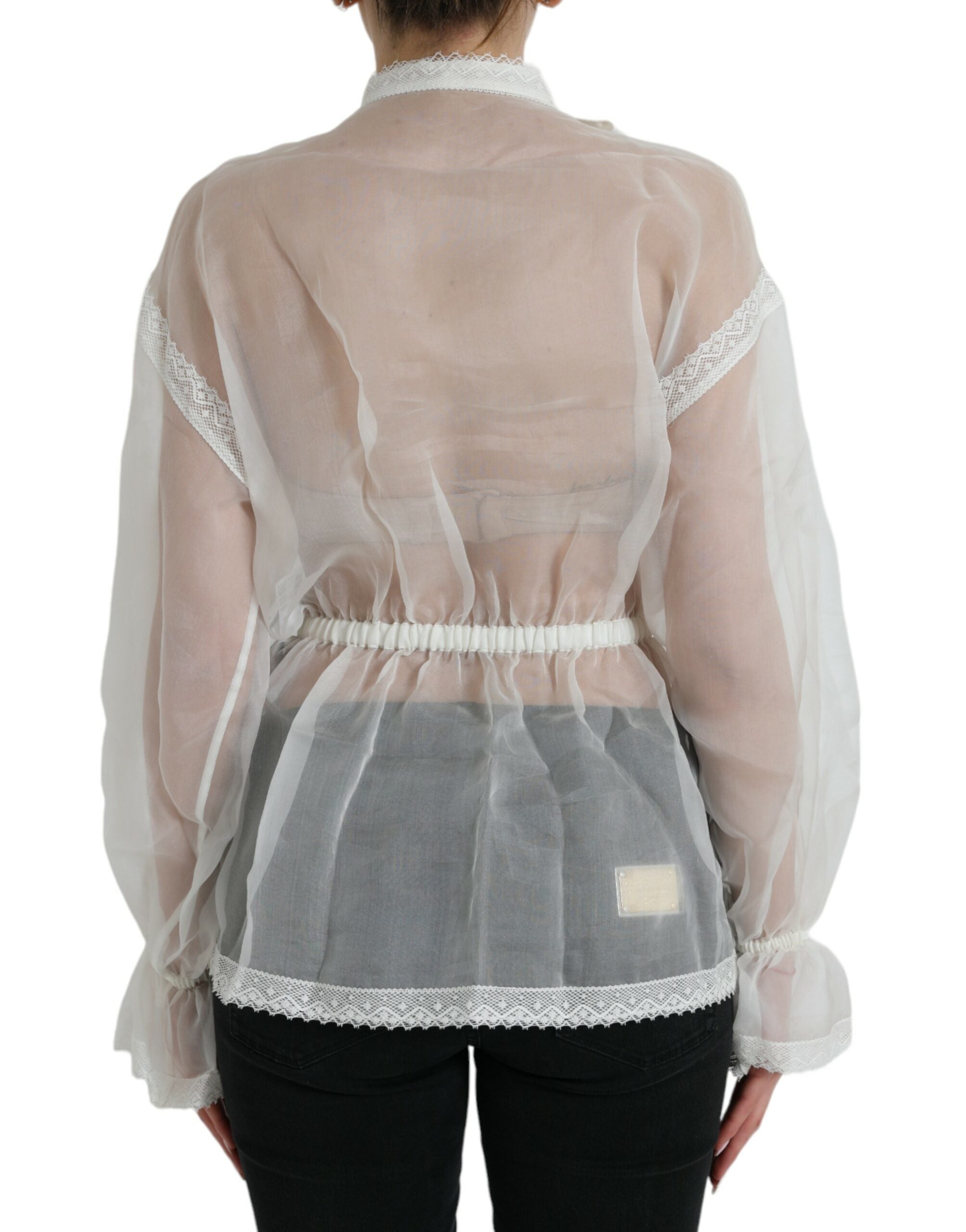 White silk long-sleeve top with ascot collar by Dolce & Gabbana, featuring elegant draped fabric and sophisticated design.
