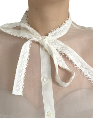 White silk long sleeve top with ascot collar by Dolce & Gabbana, featuring a elegant, smooth fabric and refined design.