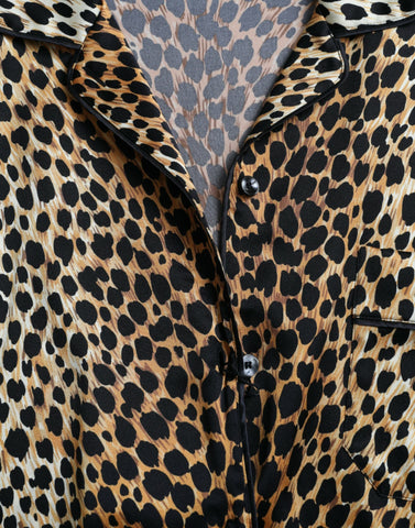 Brown leopard print long sleeve blouse top by Dolce & Gabbana, featuring a stylish animal print design and elegant long sleeves.