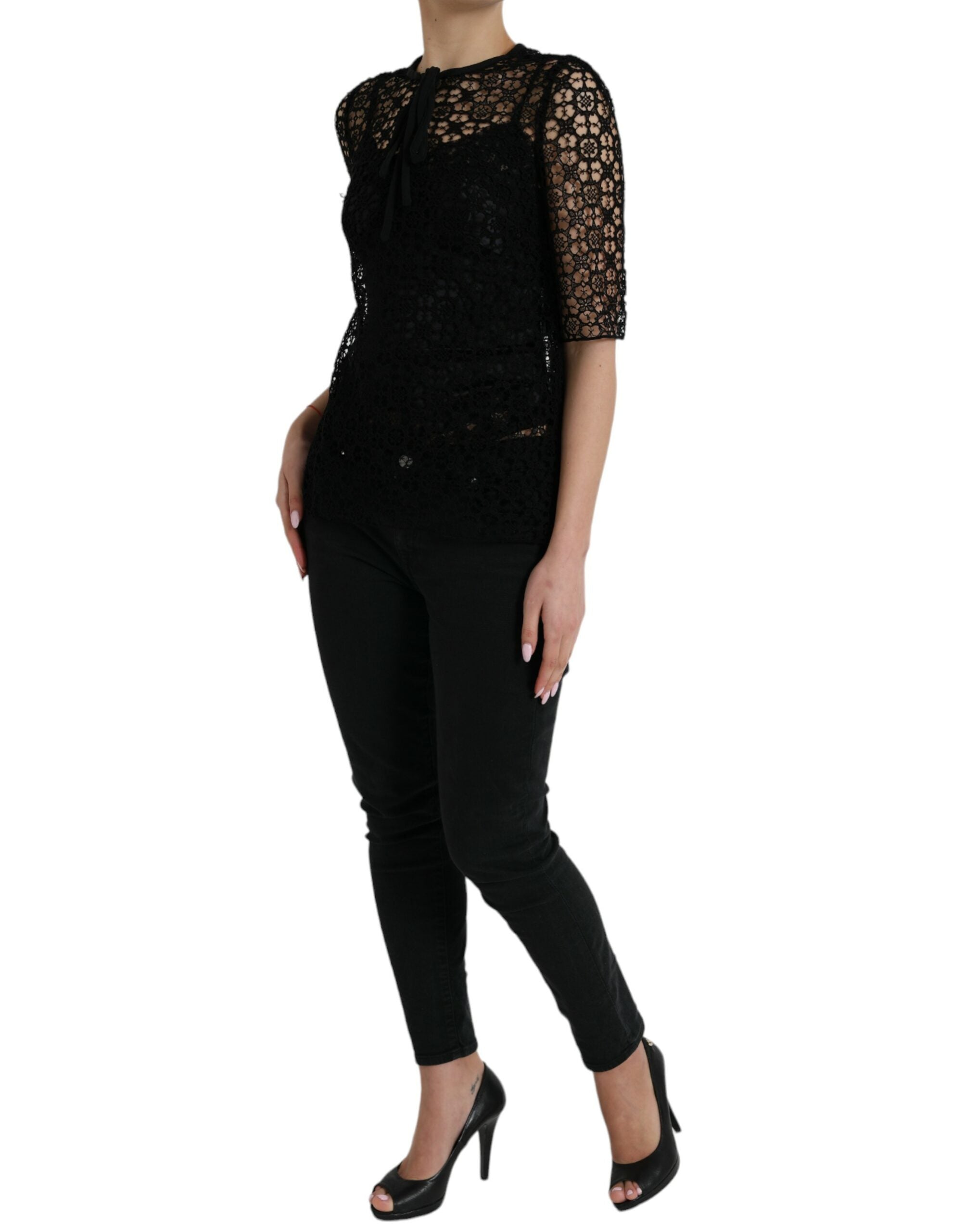 Black floral lace short-sleeve blouse top by Dolce & Gabbana with delicate lace detailing and a fitted silhouette.
