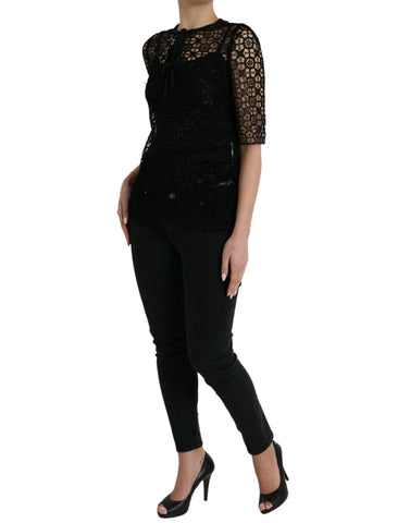 Black floral lace short-sleeve blouse top by Dolce & Gabbana with delicate lace detailing and a fitted silhouette.