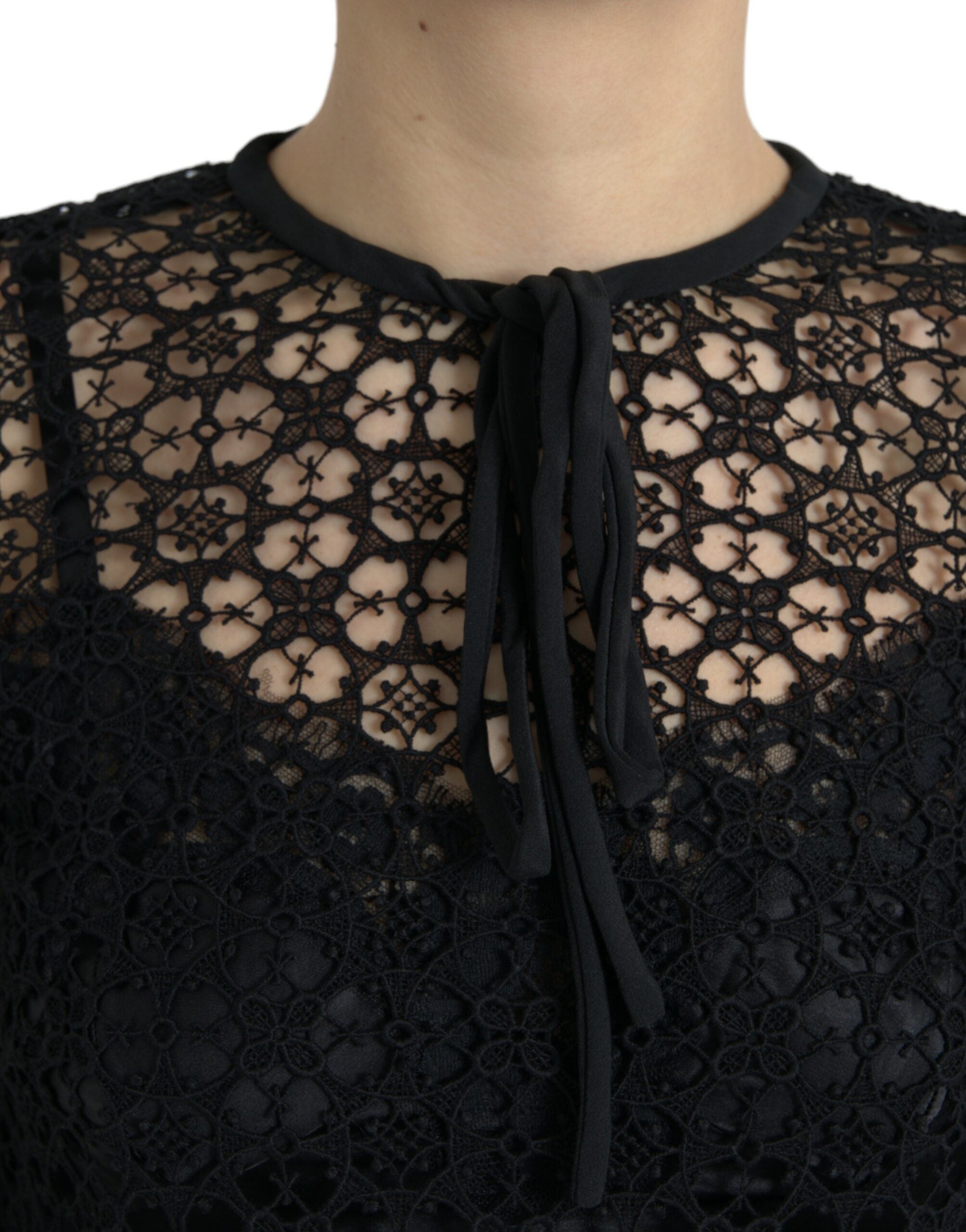Black floral lace short sleeve blouse top by Dolce & Gabbana, featuring delicate lace fabric and a stylish, feminine design.