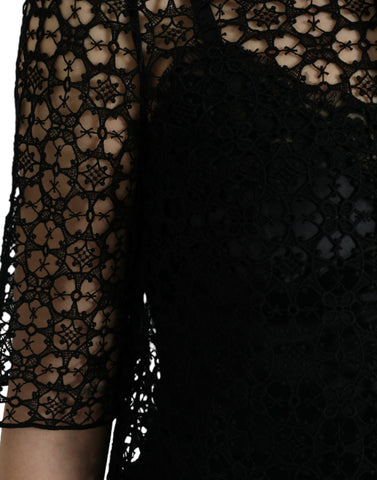 Black floral lace short sleeve blouse top by Dolce & Gabbana with intricate lace details and a elegant fit.