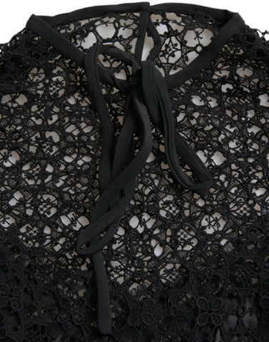 Black floral lace short-sleeve blouse top by Dolce & Gabbana, featuring delicate lace fabric and elegant short sleeves.