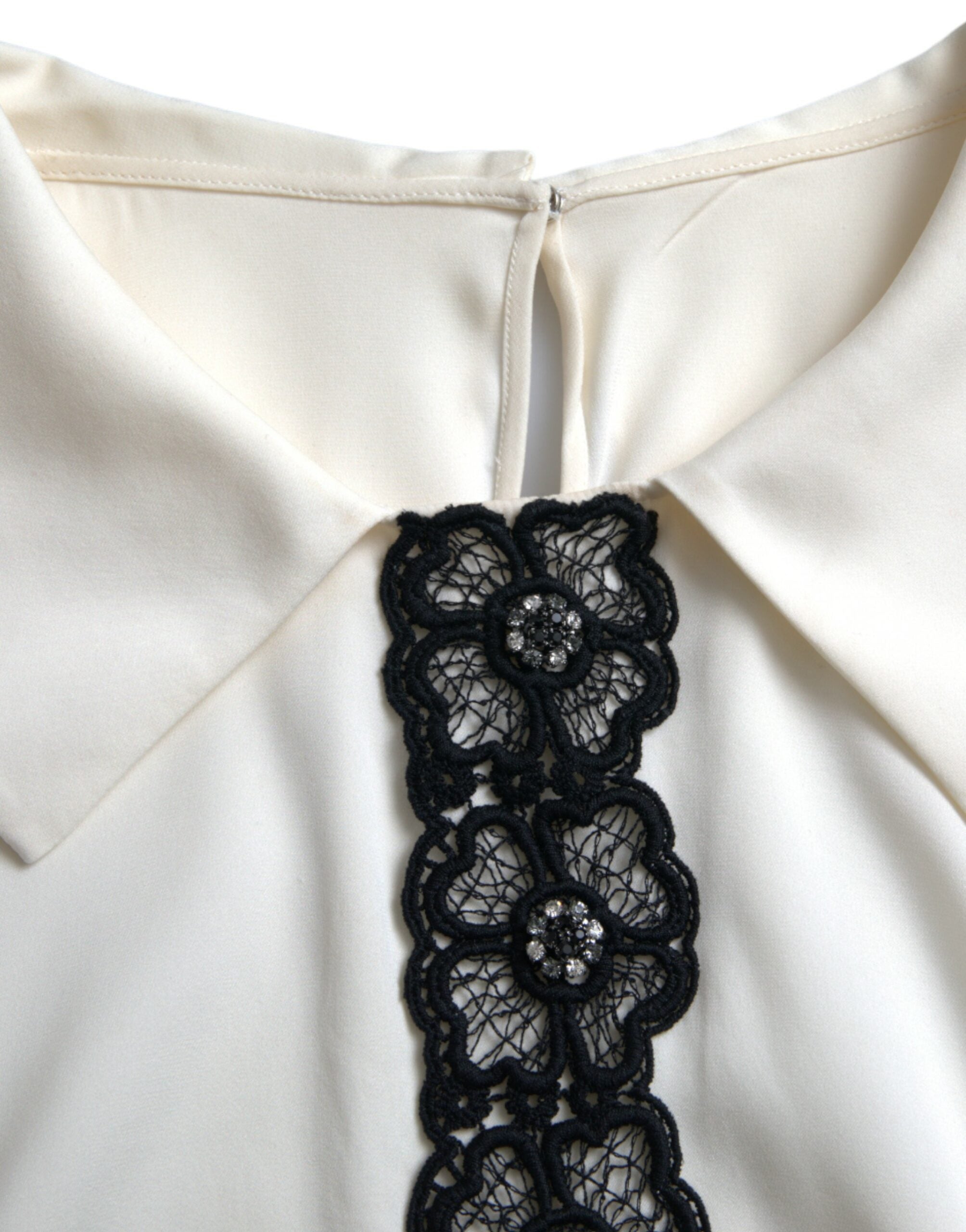 Dolce & Gabbana off-white silk short sleeve top with lace trim, stylish and elegant fashion piece.