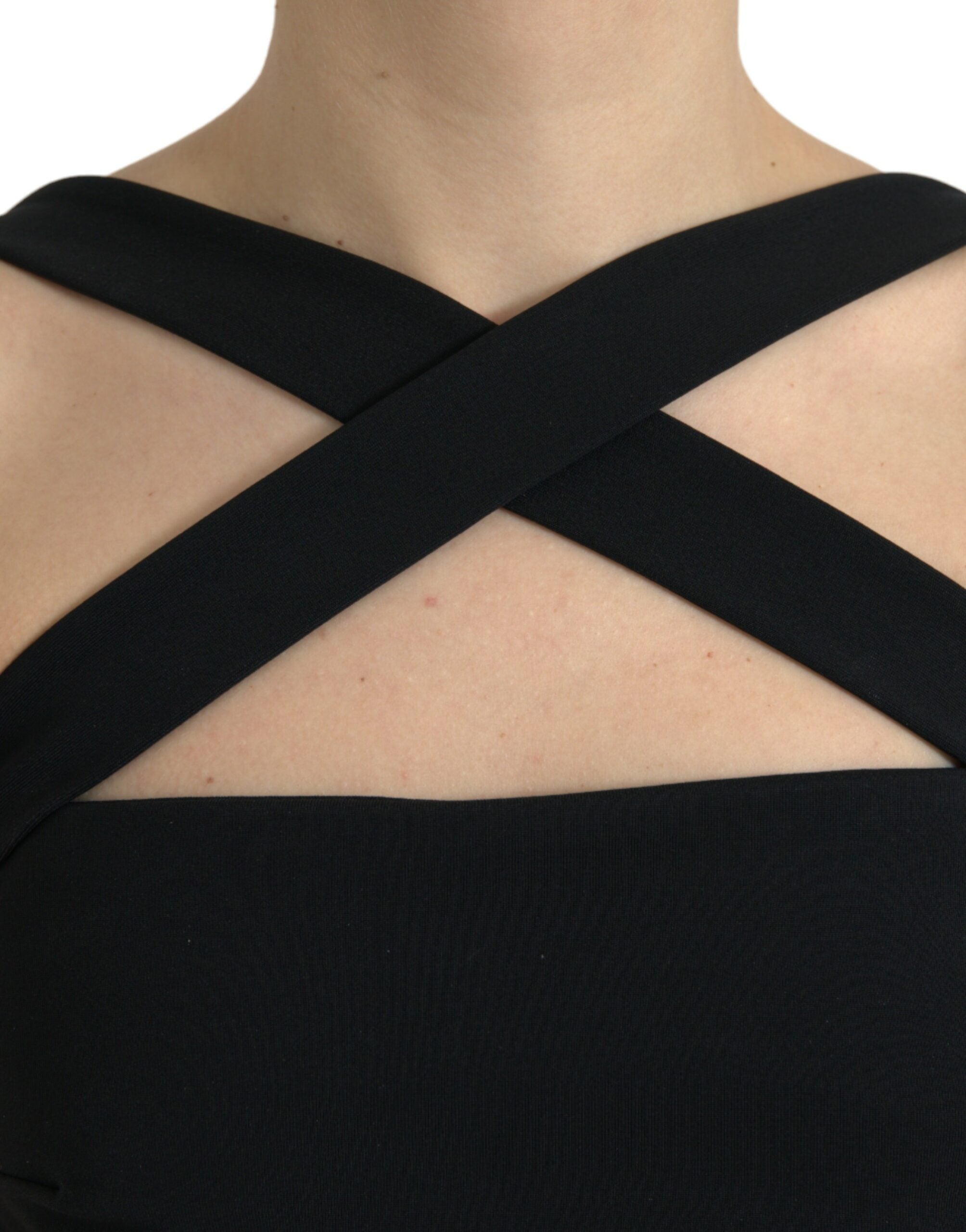 Black sheath halter sleeveless midi dress by Dolce & Gabbana, shown on a mannequin, highlighting fitted silhouette and elegant design.
