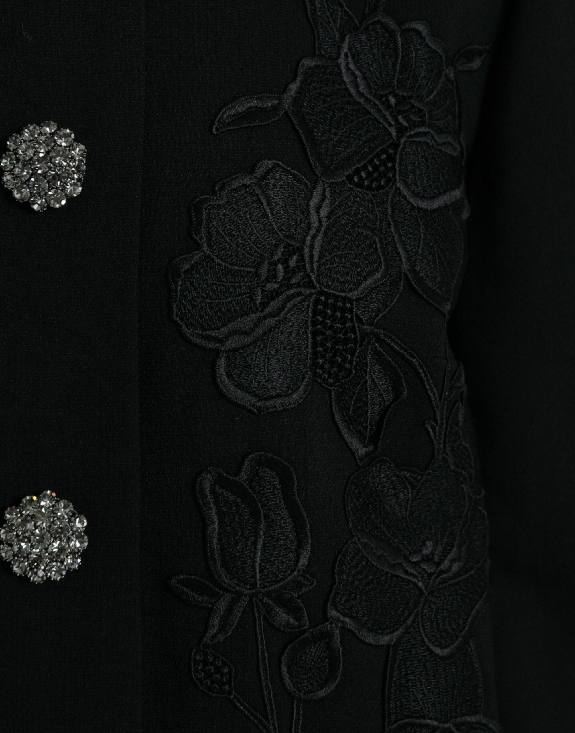Black floral wool jacket with button embellishments from Dolce & Gabbana, featuring a tailored fit and intricate floral patterns.