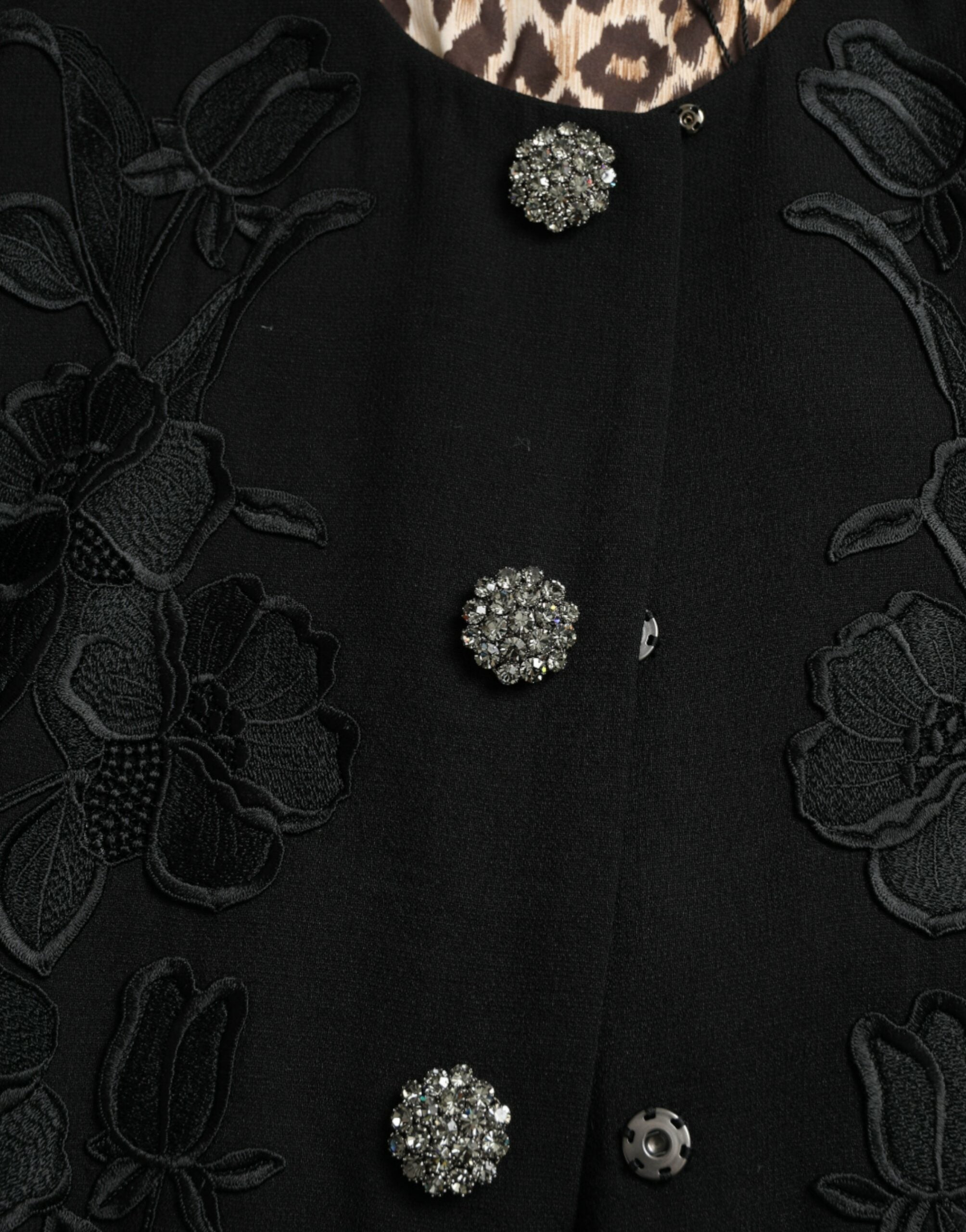 Black floral wool jacket with button embellishments from Dolce & Gabbana, featuring a tailored fit and floral embroidery.