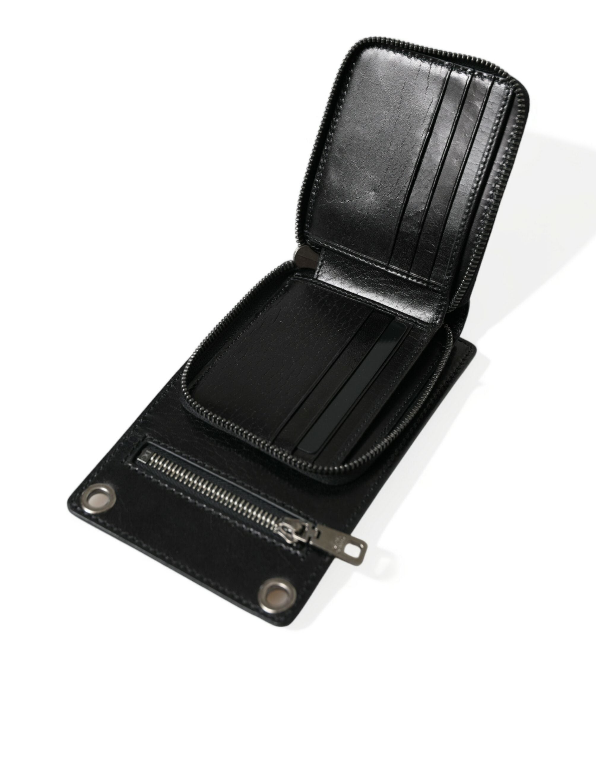 Black leather Dolce & Gabbana wallet with zip closure, logo detail, crossbody strap, and phone slot for convenient carrying.
