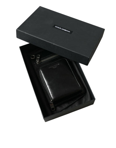Black leather Dolce & Gabbana wallet with zip closure, logo detail, crossbody strap, and phone slot for versatile carrying.