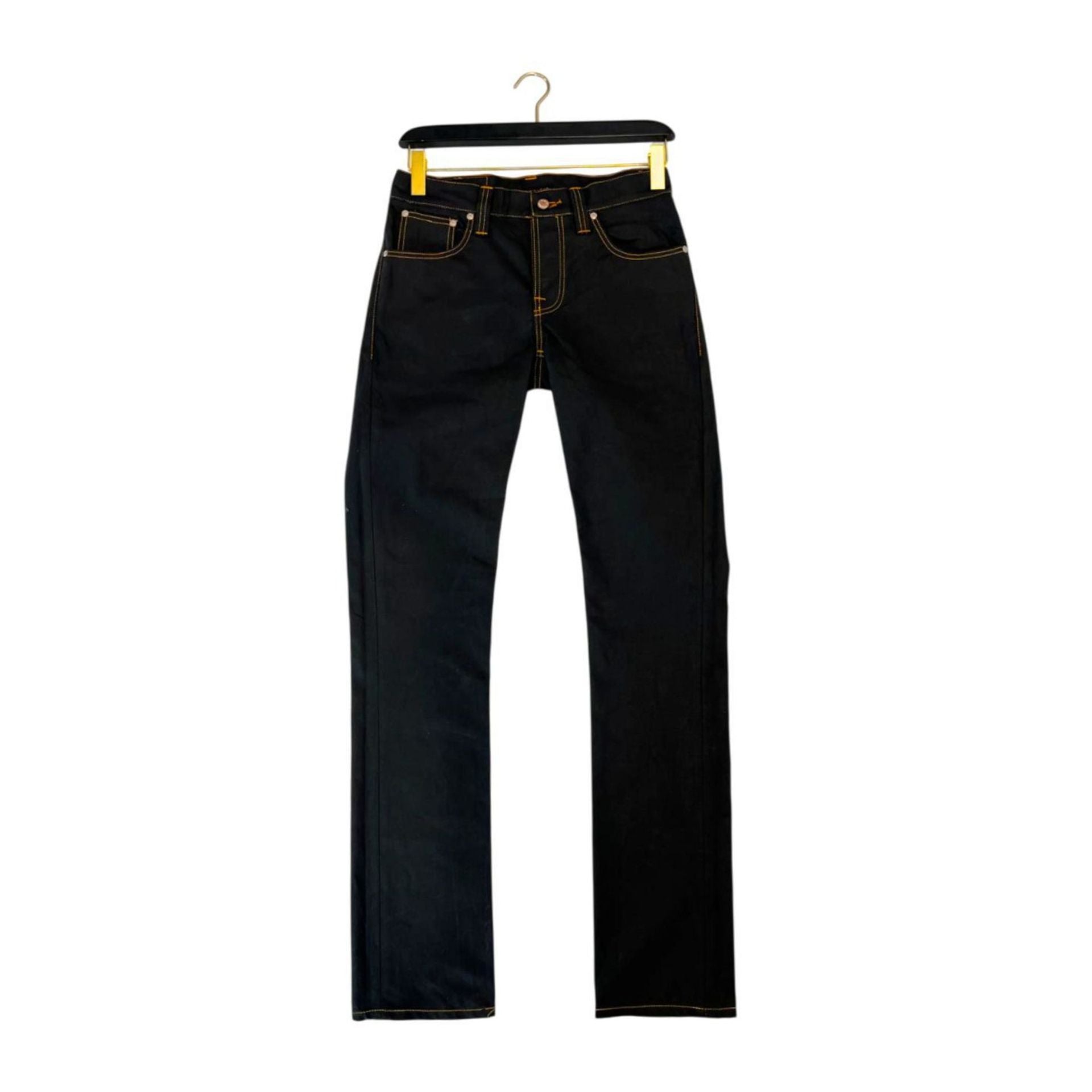 Nudie Jeans NJ2943_4GREMTIM NeroBlack denim jeans displayed on a model, showcasing slim fit and dark black wash.