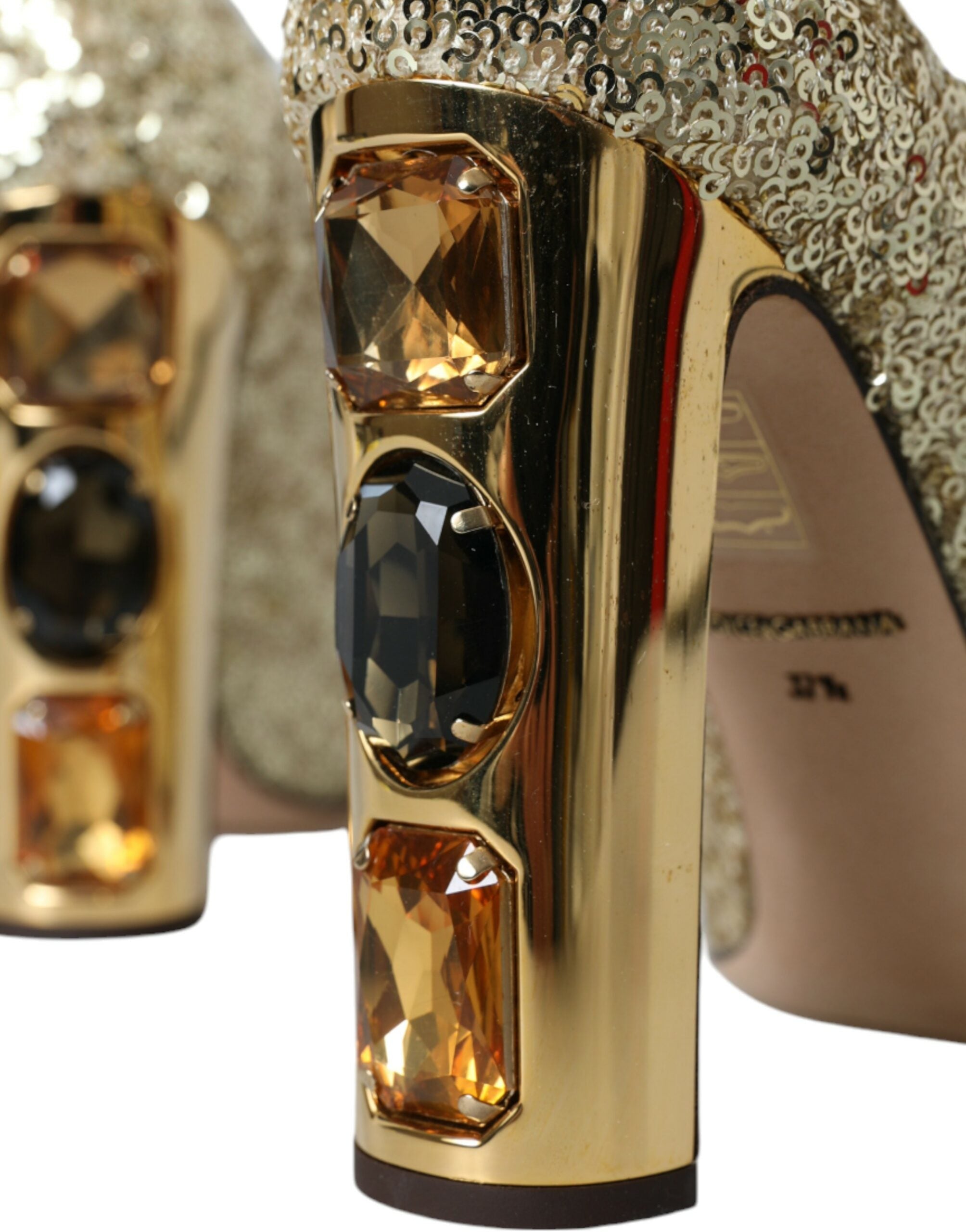 Dolce & Gabbana gold sequin crystal heels pumps shoes with pointed toe and stiletto heel on stylish runway display