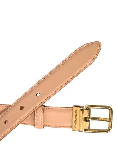 Beige calfskin leather belt with gold metal buckle from Dolce & Gabbana, showcasing smooth leather and elegant buckle detail.