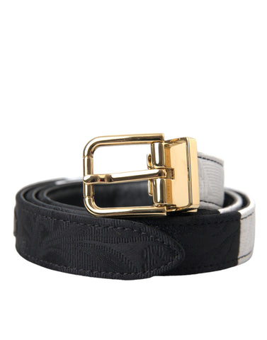 Black and white patchwork Dolce & Gabbana belt with gold metal buckle, showcasing a stylish and modern accessory.
