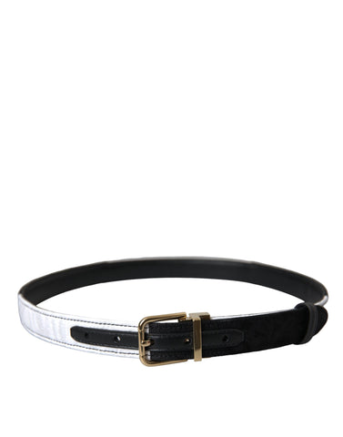 Black and white patchwork Dolce & Gabbana belt with gold metal buckle, stylish accessory with contrasting design and elegant details.