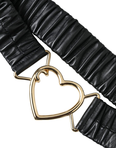 Black leather belt with gold heart-shaped metal buckle from Dolce & Gabbana, featuring a sleek and stylish design.